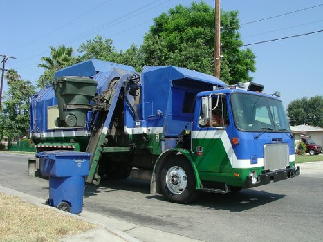 Company van and crew preparing for a commercial waste collection in Colindale