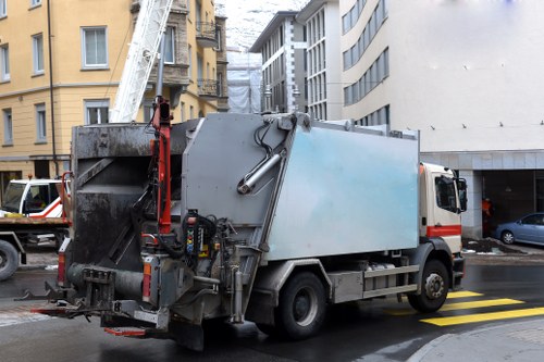 Office and retail waste being loaded onto a man and van in Colindale